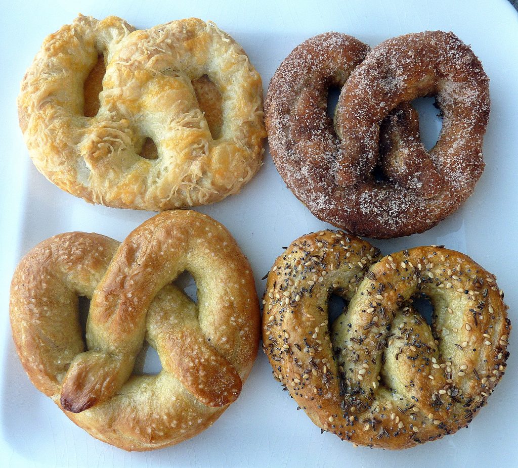 These Homemade Soft Pretzels were made four different ways: salted, cheesy, everything, and coated in cinnamon sugar! This post includes a how-to with step by step photos.