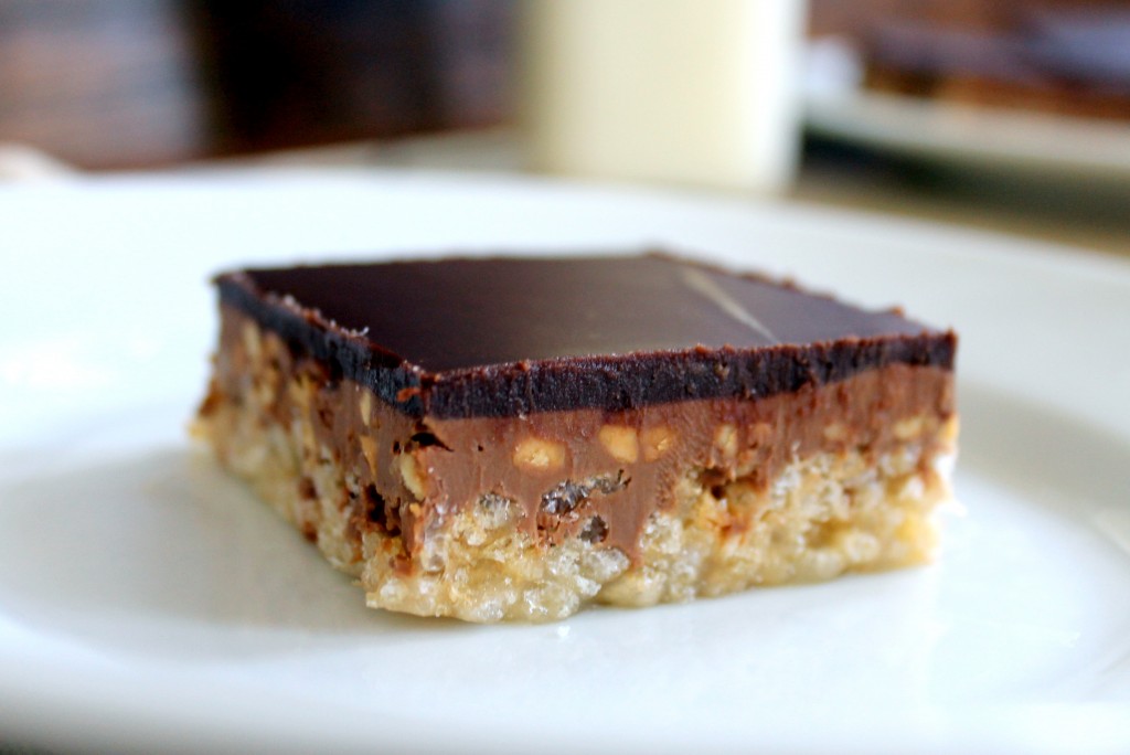 The recipe for these Chocolate Peanut Butter Crispy Bars makes a delicious dessert that is oozing with creamy peanut butter and chocolate over a crunchy layer of rice krispies.