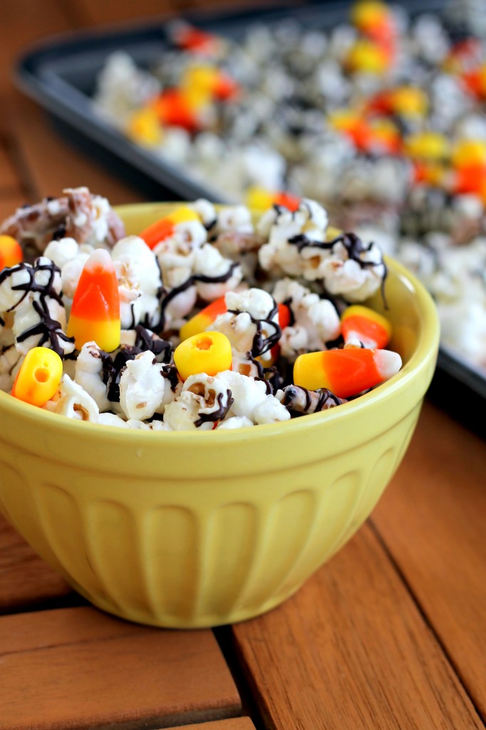 This White Chocolate Candy Corn Popcorn is tossed with pretzels, candy corn, white chocolate, and a drizzle of dark chocolate for a Halloween treat!