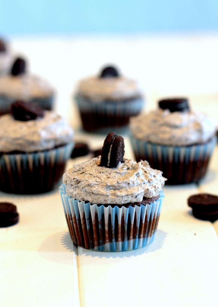 These Cookies and Cream Cupcakes have an Oreo cookie bottom, an amazing doctored up cake mix chocolate cupcake, topped with the best cookies and cream frosting ever!