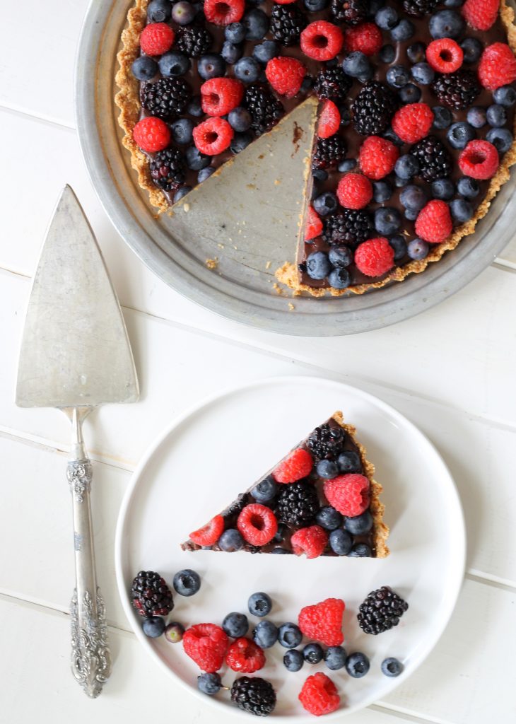 This Chocolate Berry Tart has vegan chocolate ganache in an almond flour crust, topped with berries! It is Paleo, gluten-free, vegan and refined sugar-free.