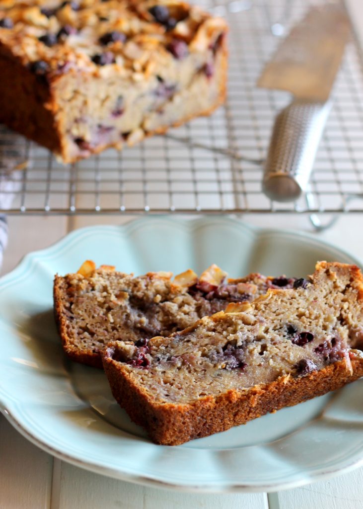 This Toasted Coconut Blueberry Banana Bread boasts delicious flavors - you'd never know that it was low-fat (no butter or oil!), low-sugar, and gluten-free! #bakerita #blueberrybread #bread #blueberries #glutenfree #quickloaf #coconut