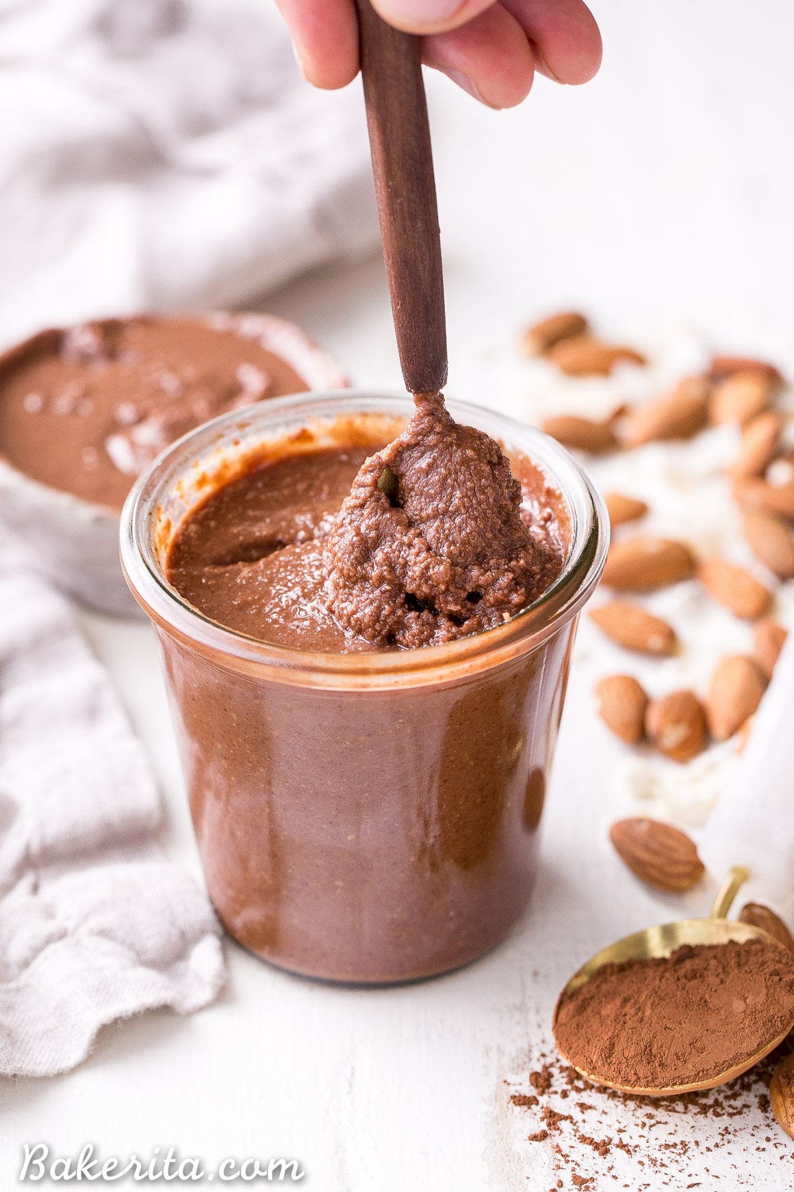 This Dark Chocolate Coconut Almond Butter is a decadent homemade nut butter that will satisfy all your chocolate cravings. This paleo and vegan chocolate spread is perfect with bananas, apples, oatmeal, or with a spoon!