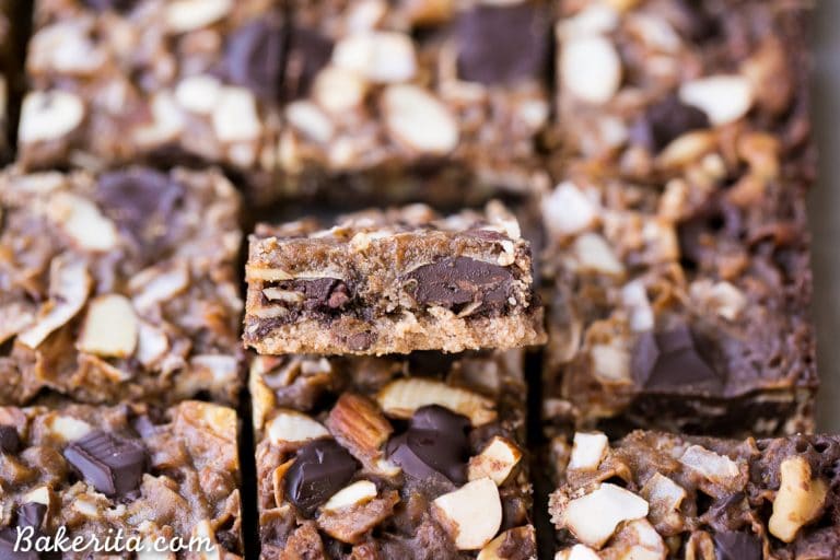 These Paleo Magic Cookie Bars are just as rich and delicious as the classic seven layer bars you know and love! This gluten-free, vegan, and refined sugar free version has an almond flour crust and homemade coconut milk caramel.
