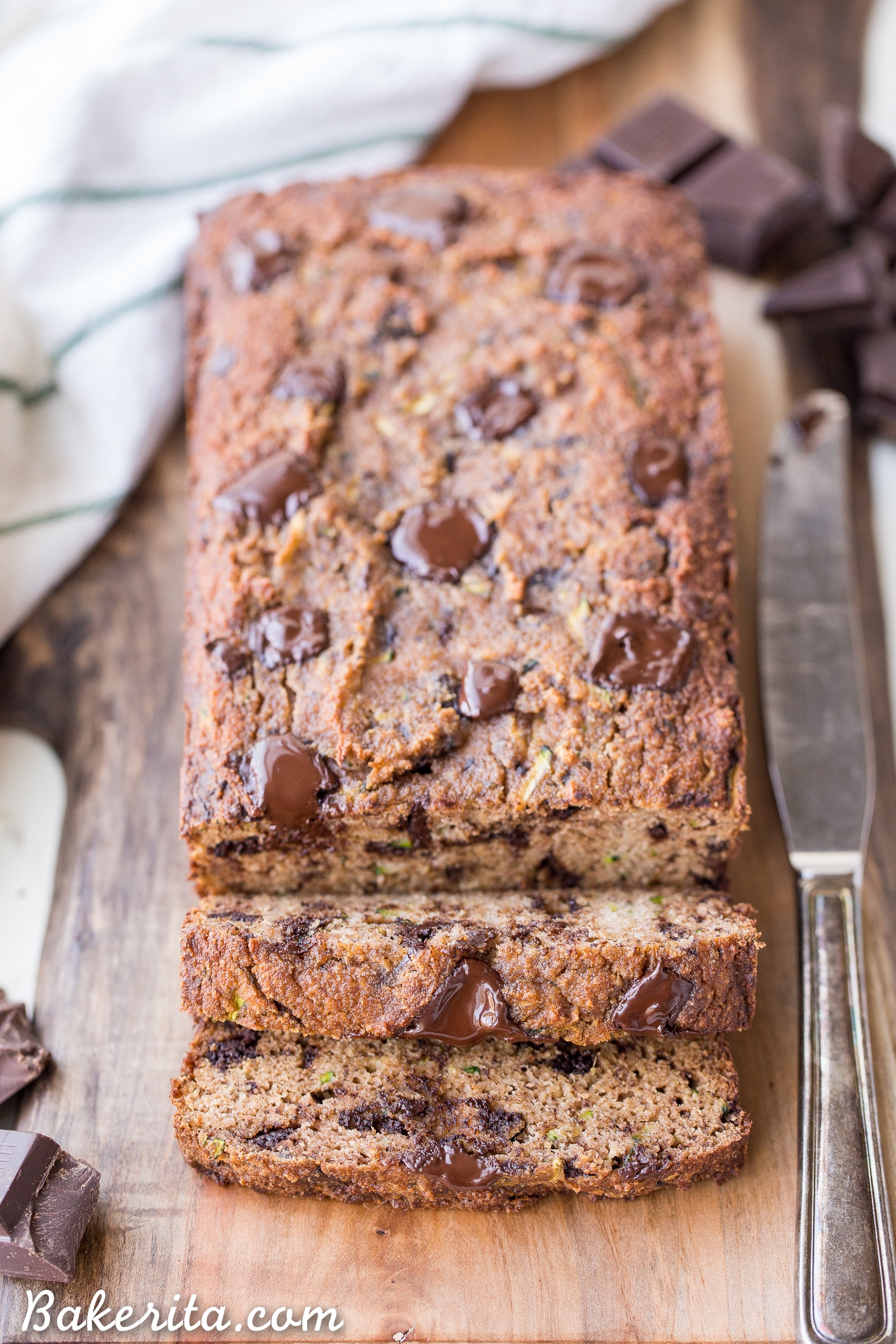 This Chocolate Chunk Zucchini Bread is soft and moist with a tender crumb, and it's not too sweet. This quick bread is Paleo friendly, gluten-free, grain-free, and refined sugar-free.