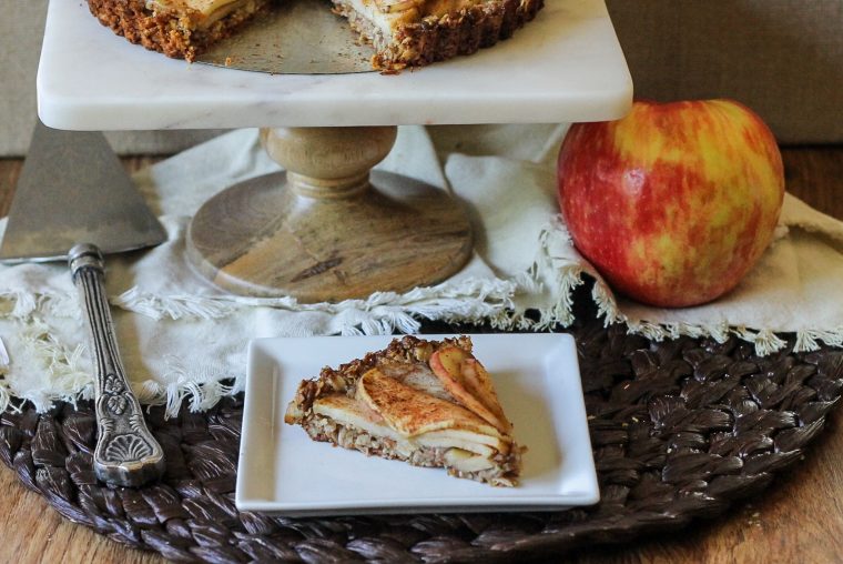 This Spiced Apple Tart features cinnamon and nutmeg spiced apples nestled in an oatmeal-almond crust. This gluten-free and vegan dessert is healthy enough to double as breakfast! #vegan #glutenfree #vegan #dessertrecipe #appletart