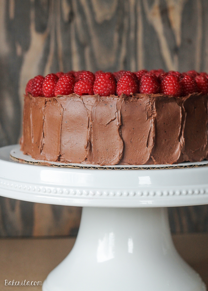 This Mocha Raspberry Cake has two layers of moist chocolate cake, a layer of sweet raspberry filling, frosted with a silky mocha buttercream and topped with fresh raspberries! This impressive cake is perfect for celebrating. 