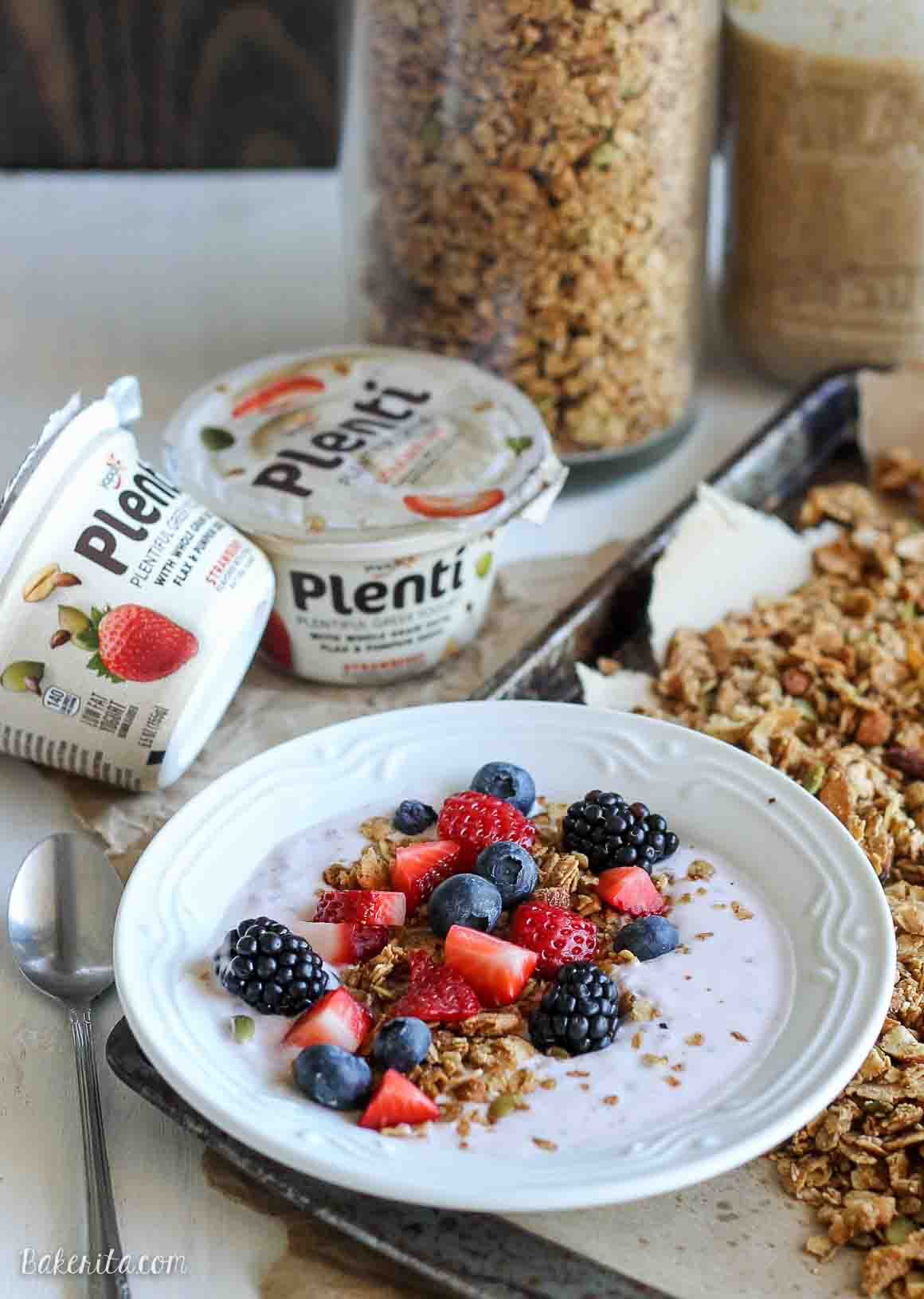 This Almond Coconut Butter Granola is the perfect topping for your morning yogurt, or it's great on it's own as a heathy snack! This easy recipe is gluten-free, refined sugar free, and vegan.