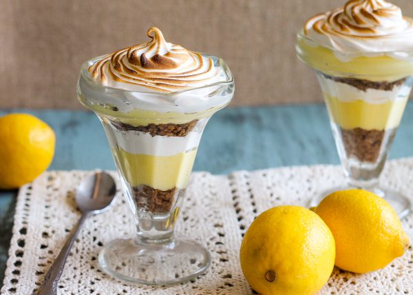 These Lemon Meringue Pie Parfaits are a no-bake dessert that will be your new summer favorite! Lemon curd, graham cracker crumbs, and meringue makes the best individual treats.