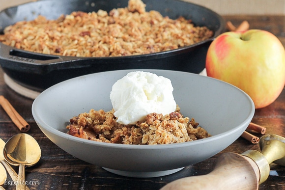 This classic Apple Crisp is made with firm, lightly sweetened and spiced apples and topped with a crispy crumble topping with oats and pecans. It's baked in a skillet and best served with vanilla ice cream!