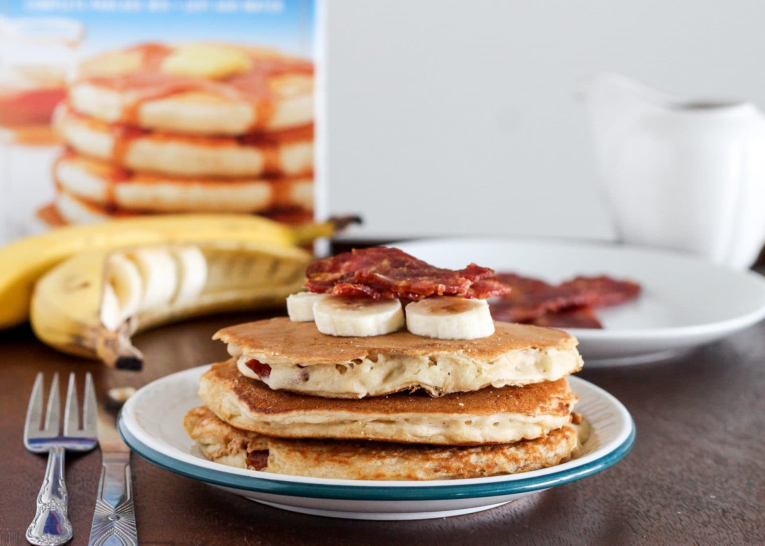These Elvis Pancakes are banana peanut butter pancakes stuffed with peanut butter and bacon. These are the ultimate breakfast treat - made with only 4 ingredients!