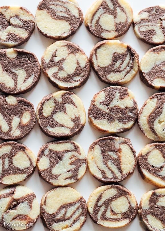 This recipe for Chocolate Vanilla Swirl Icebox Cookies makes tons of cookies that are perfect for holiday baking. They look beautiful and you can keep a roll in your fridge or freezer, ready to slice 'n bake!