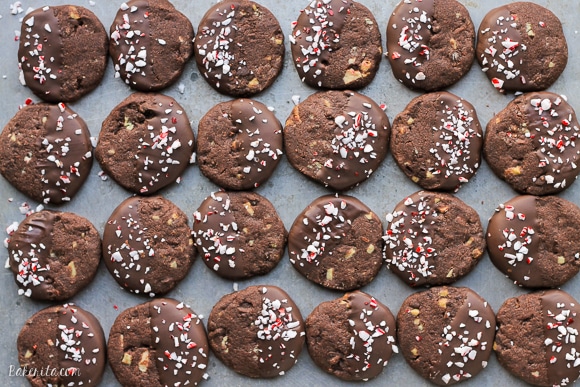 Chocolate Mint Shortbread Cookies are easy to make slice n' bake cookies that are perfect for gifting! These crunchy chocolate cookies have a minty chocolate coating and sprinkle of crushed candy canes.