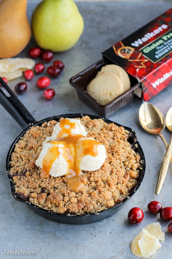 This Pear Cranberry Ginger Crisp is a mix of sweet, tart, and little spicy with a buttery shortbread cookie crumble! This festive holiday dessert is gluten-free and doubles easily.