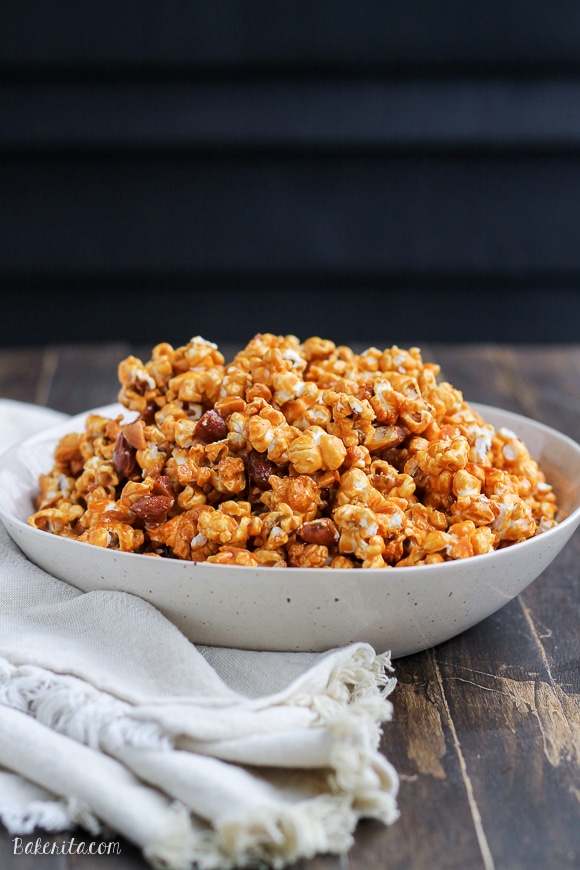 This Salted Honey Almond Caramel Corn is an addictive snack you can give as a gift or serve to a crowd. This caramel corn is made without corn-syrup and uses honey instead - it also has a sprinkle of sea salt!