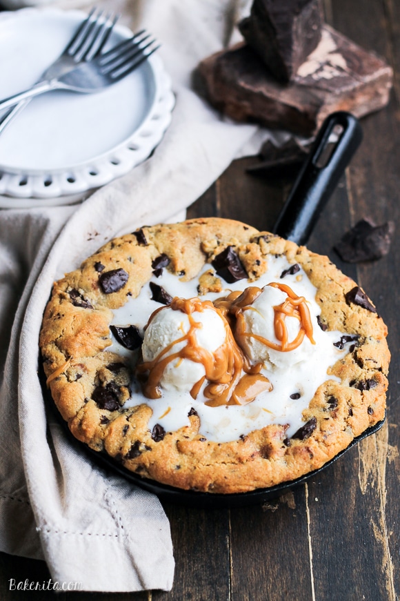 This Peanut Butter Chocolate Chip Skillet Cookie is a peanut butter lover's dream!! The peanut butter cookie stays soft in the center while the edges get crispy, and a layer of peanut butter in the center takes this skillet cookie over the top.