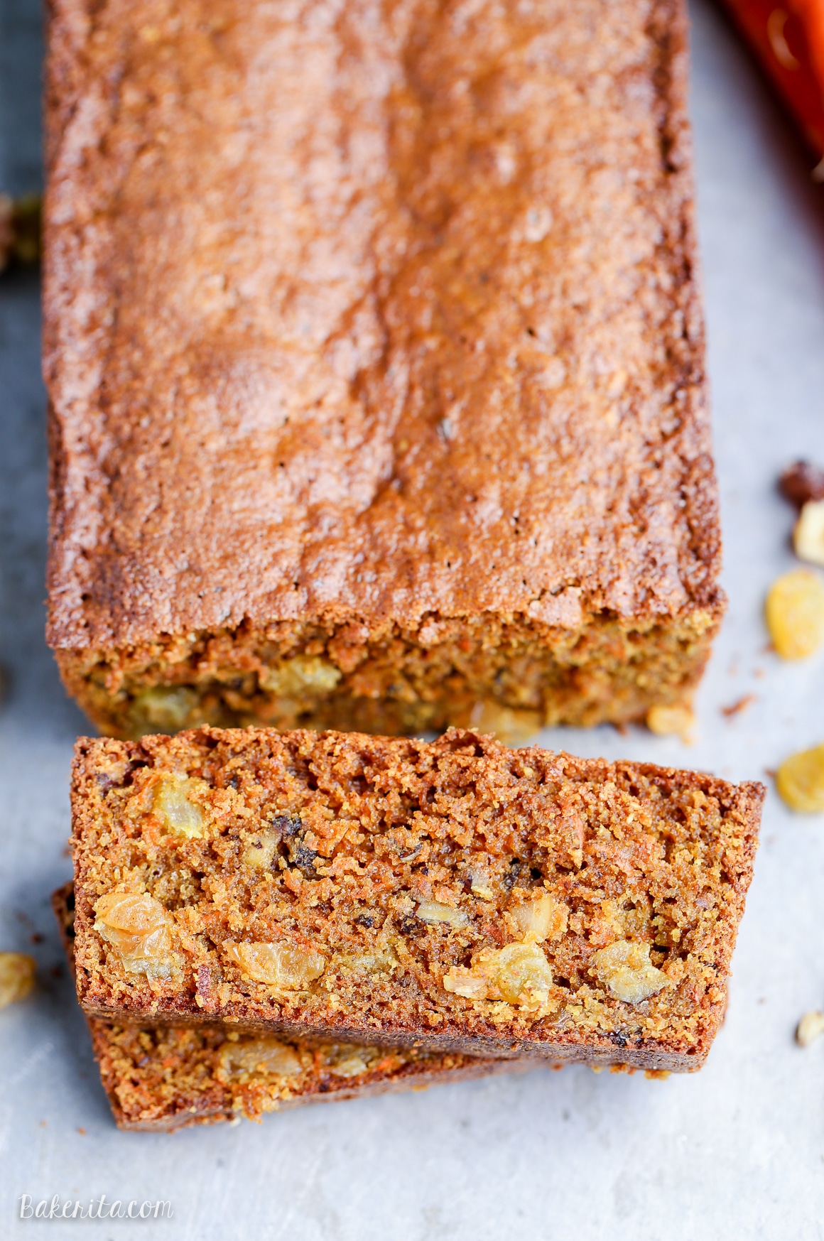 This Paleo Carrot Bread is incredibly moist, and full of spices, chopped walnuts and golden raisins. This hearty bread is gluten-free and refined sugar free.