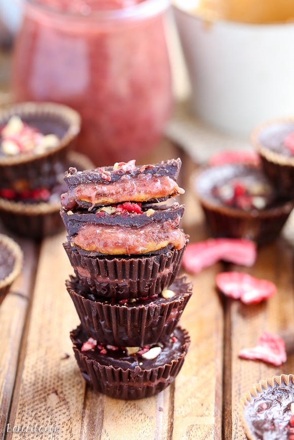 These Chocolate Peanut Butter & Jelly Cups are homemade peanut butter cups with an added layer of jam or jelly! This healthier candy recipe is only 5 ingredients, and uses an easy refined sugar free chocolate recipe.