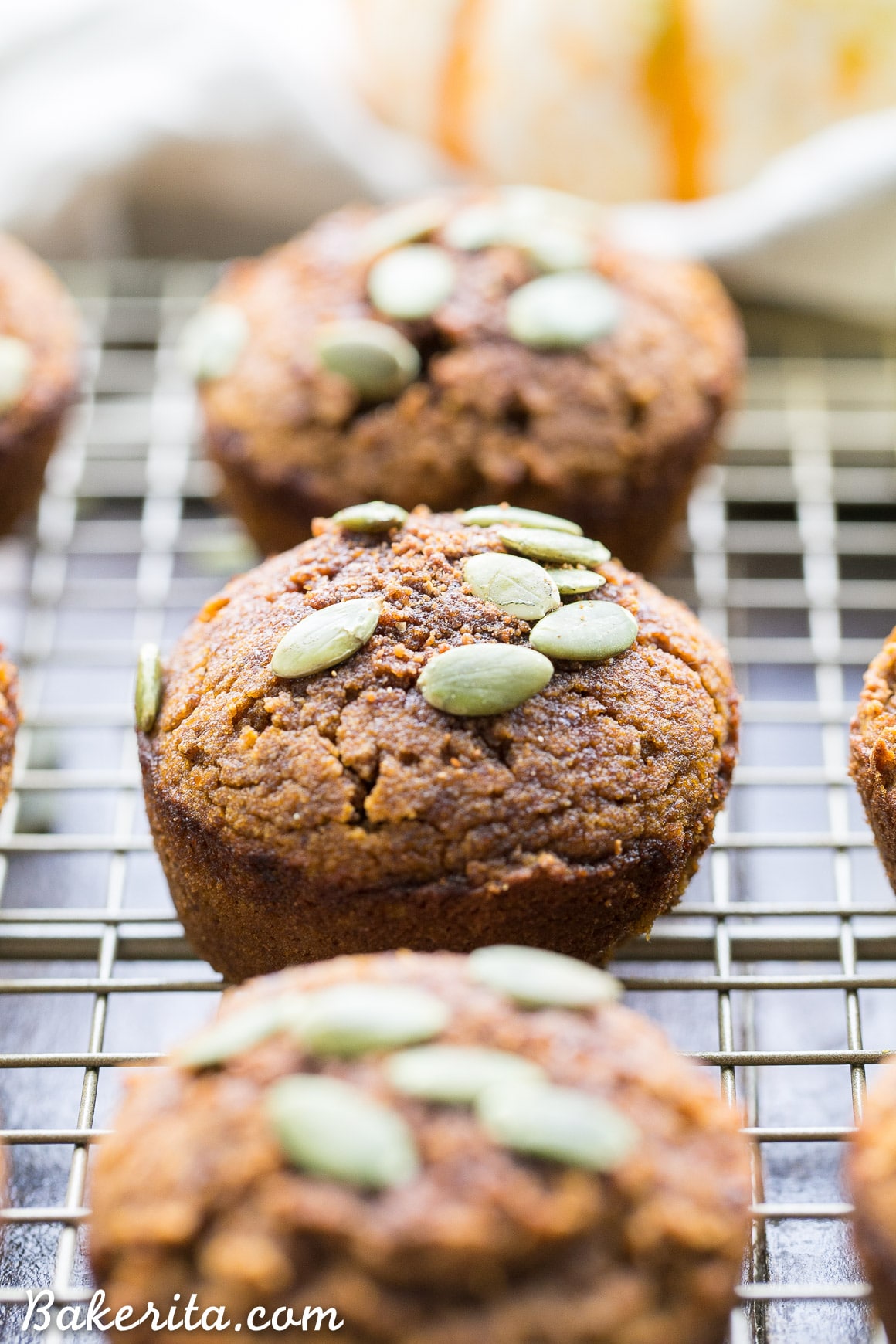 These Paleo Pumpkin Muffins, made with coconut flour and almond butter, are moist, fluffy, and lightly spiced with cinnamon and nutmeg. These healthy muffins make a great breakfast or snack and freeze well.