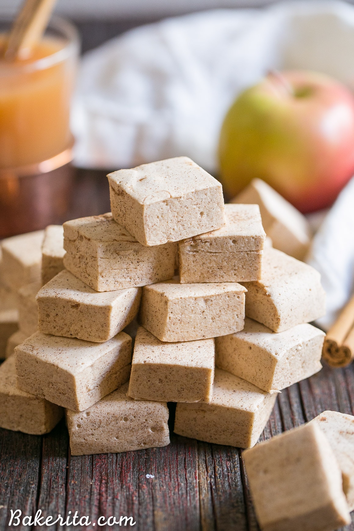 These Paleo Apple Spice Marshmallows are sweetened with maple syrup and flavored with apple juice + loads of warm spices! Homemade marshmallows are easier than you'd think, and you'll love these on their own or as the perfect apple cider addition.