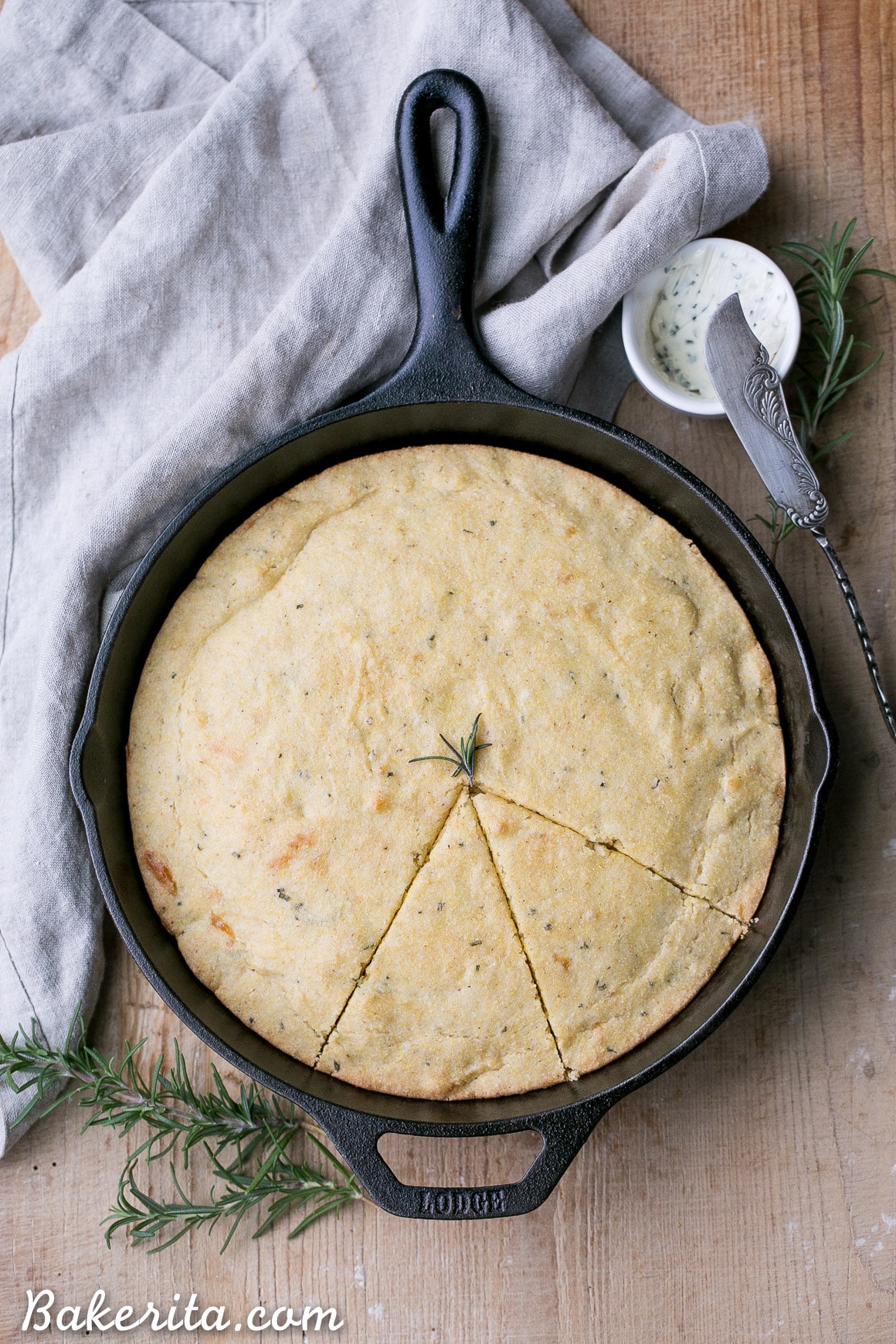 This Gluten Free Asiago Rosemary Cornbread is an easy, savory cornbread that's moist and flavorful. A slice of this gluten-free cornbread is perfect with a slather of butter or served with a bowl of soup!