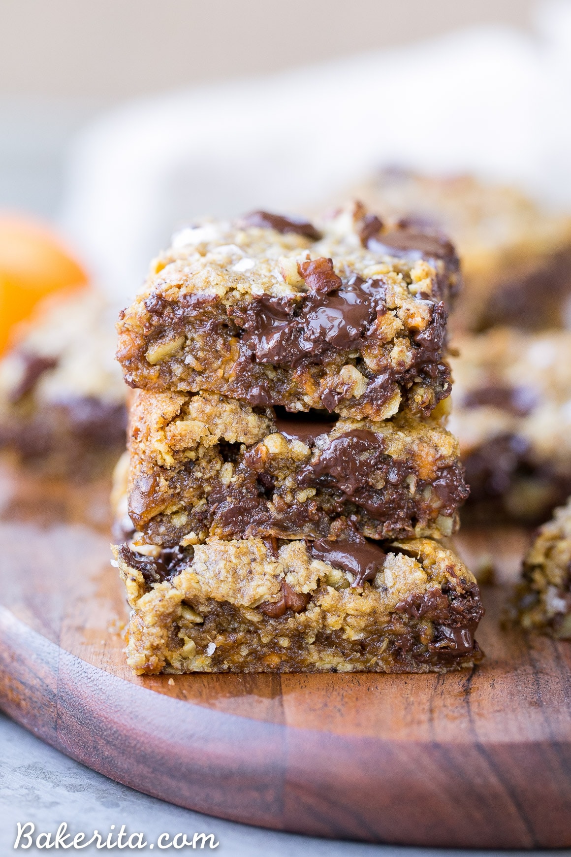 These Pumpkin Oatmeal Scotchie Bars with Chocolate Chips + Pecans are soft, gooey, and absolutely irresistible! These decadent dessert bars couldn't be easier to make.