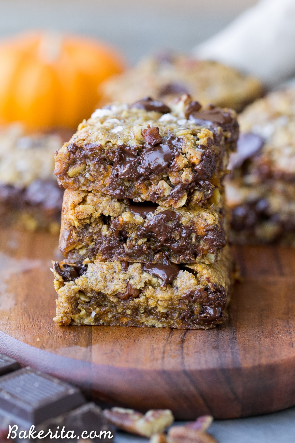 These Pumpkin Oatmeal Scotchie Bars with Chocolate Chips + Pecans are soft, gooey, and absolutely irresistible! These decadent dessert bars couldn't be easier to make.