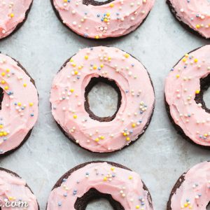 These Chocolate Beet Donuts are incredibly moist and chocolatey, with a naturally pink-tinted beet frosting on top! These gluten-free, paleo and dairy-free donuts make the perfect indulgent breakfast, snack, or dessert.