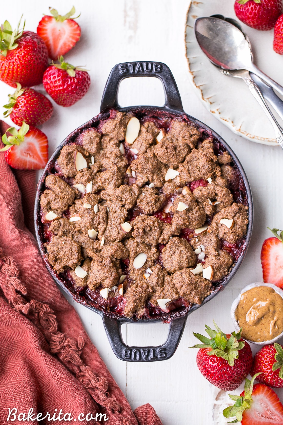 This Strawberry Crisp with Almond Butter Crumble is an irresistible pairing of fresh strawberries and a lightly-sweetened, rich and crispy almond butter cookie crumble. You won't be able to resist this gluten-free, paleo, and vegan dessert.
