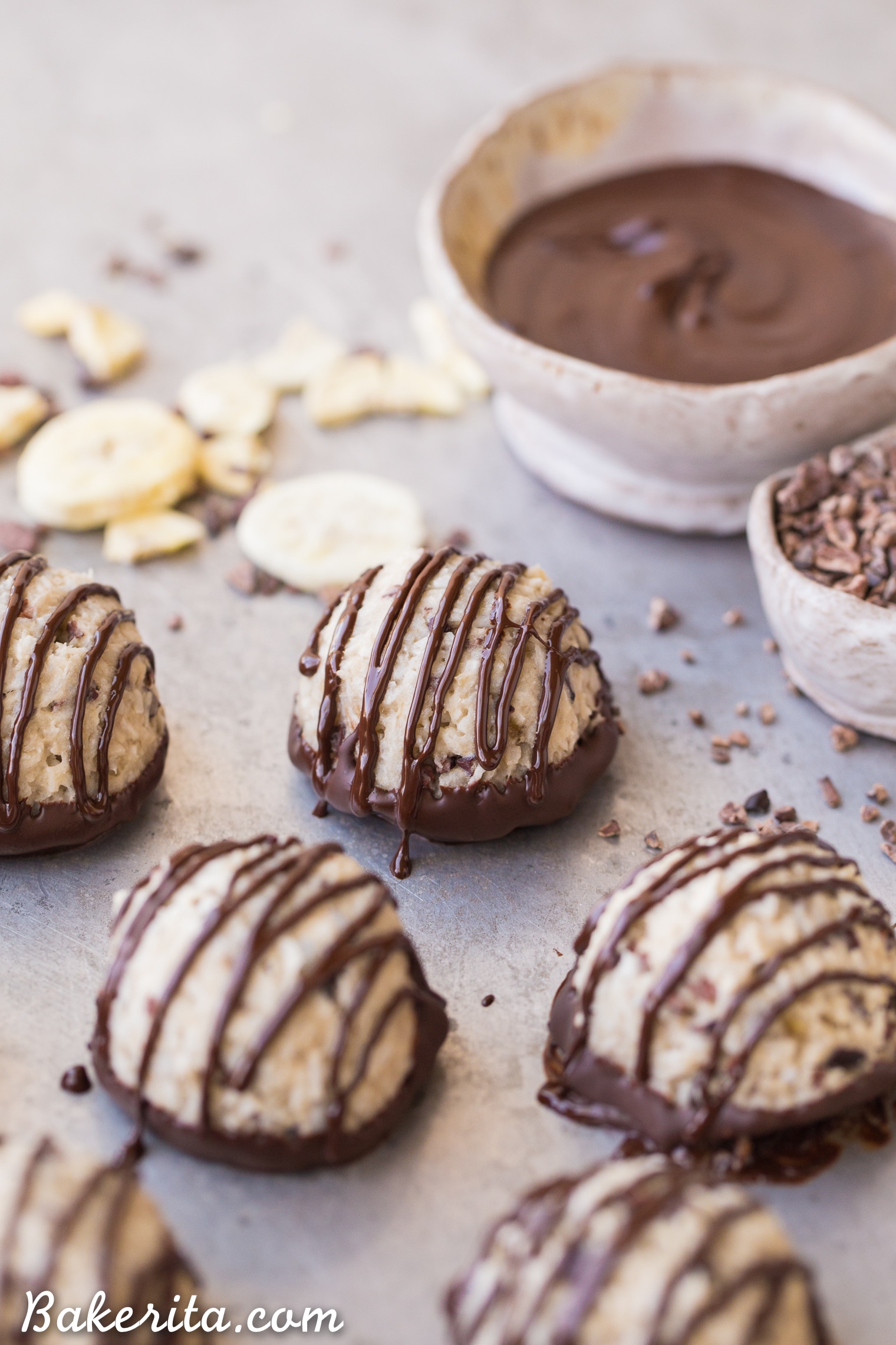 These No-Bake Chocolate Dipped Banana Macaroons are a quick and easy treat bursting with banana flavor! These gluten-free, paleo, vegan, and nut-free macaroons are hard to resist, especially once they're dipped and drizzled with dark chocolate.