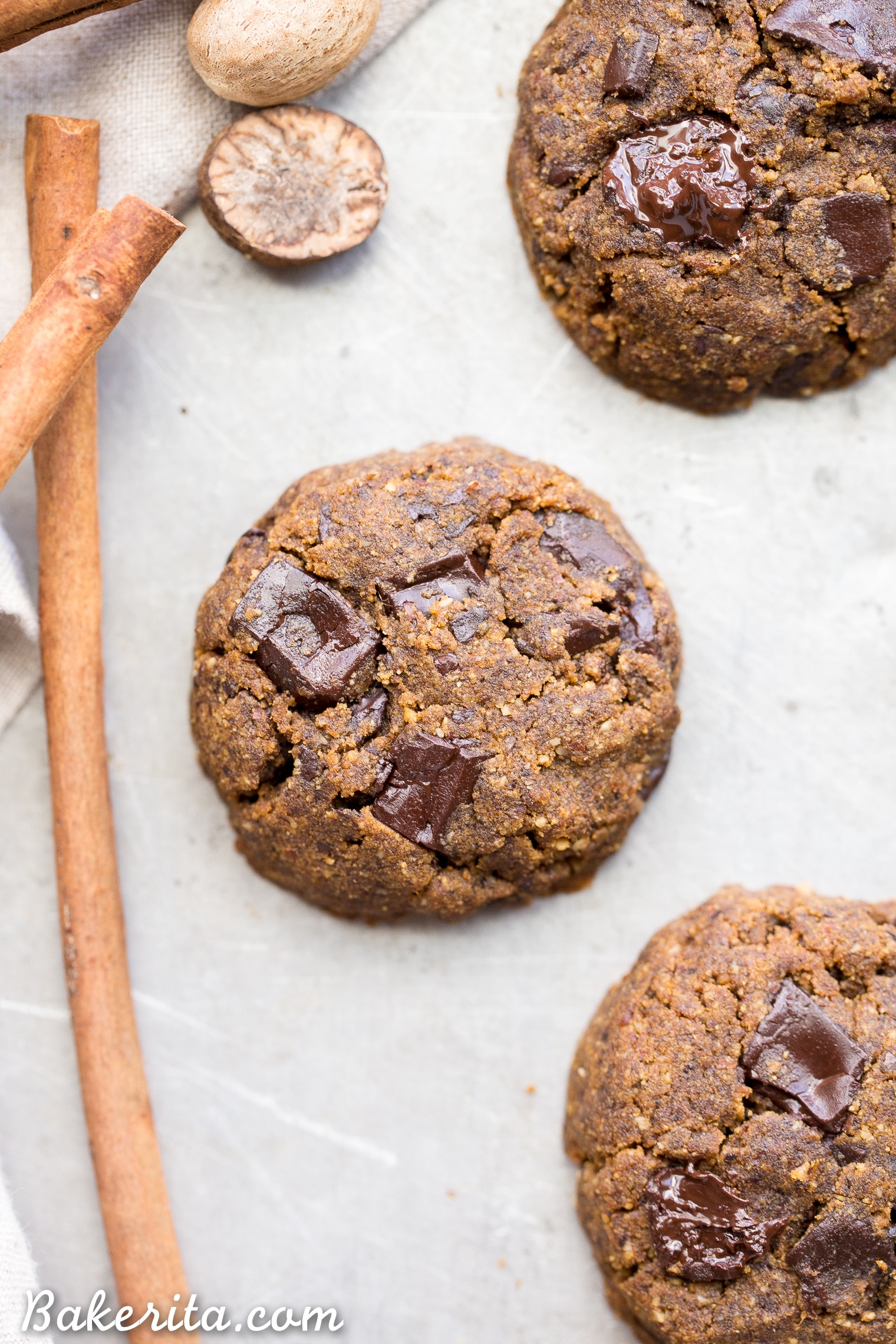 These Soft Chocolate Chip Pumpkin Cookies are a cakey and delicious spiced cookie that’s loaded with chocolate! If you like softer cookies, you’ll adore these gluten-free, paleo + vegan pumpkin cookies.