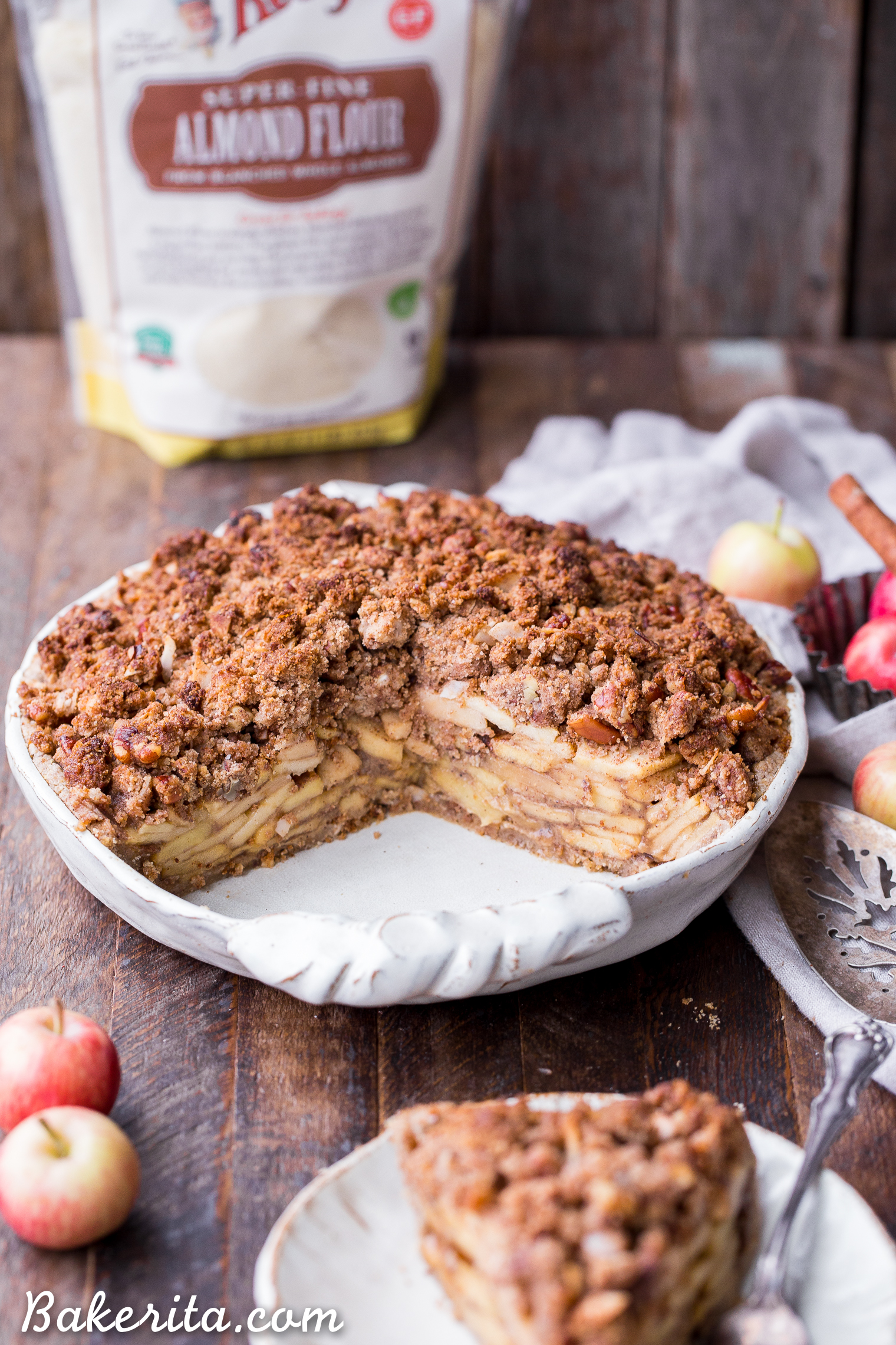 This Apple Crumble Pie is so delicious it's bound to be a holiday dessert staple! This gluten free, paleo + vegan pie is filled with soft, caramelized apples and topped with a nutty, crunchy paleo crumble topping.