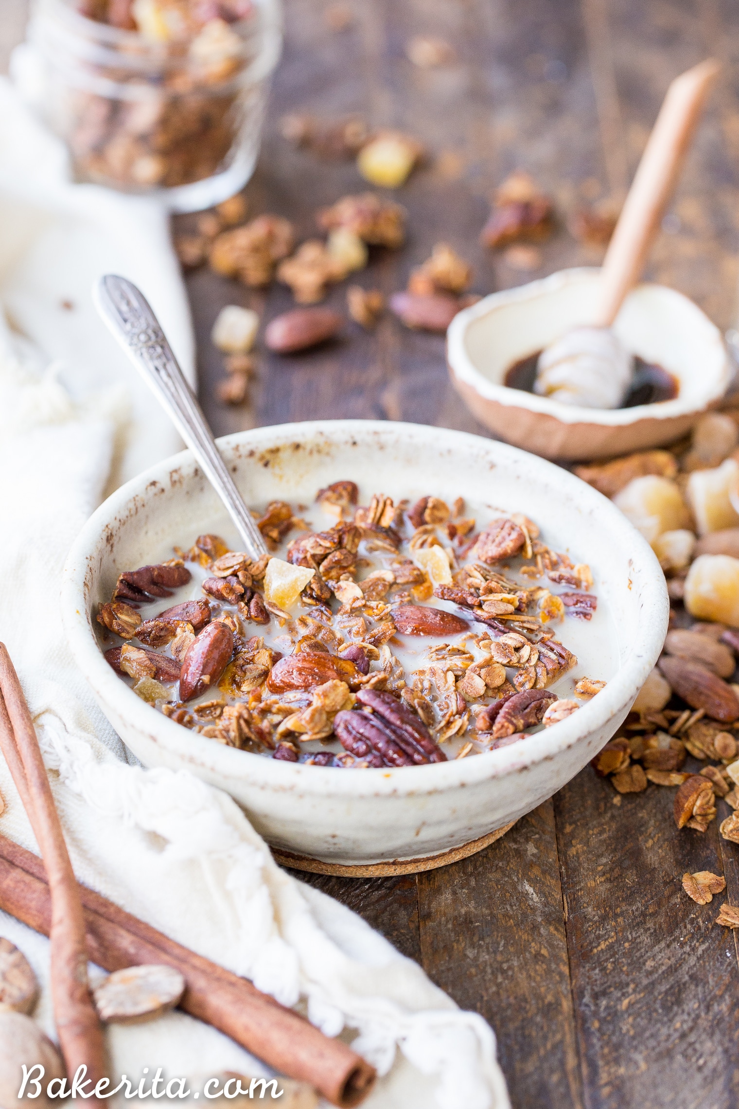 This Gingerbread Granola is crunchy & full of clusters, with loads of warm gingerbread spices, molasses, and bits of chewy crystallized ginger. This gluten-free and vegan breakfast is perfect for breakfast, or to package up in a cute jar and gift as a gift!