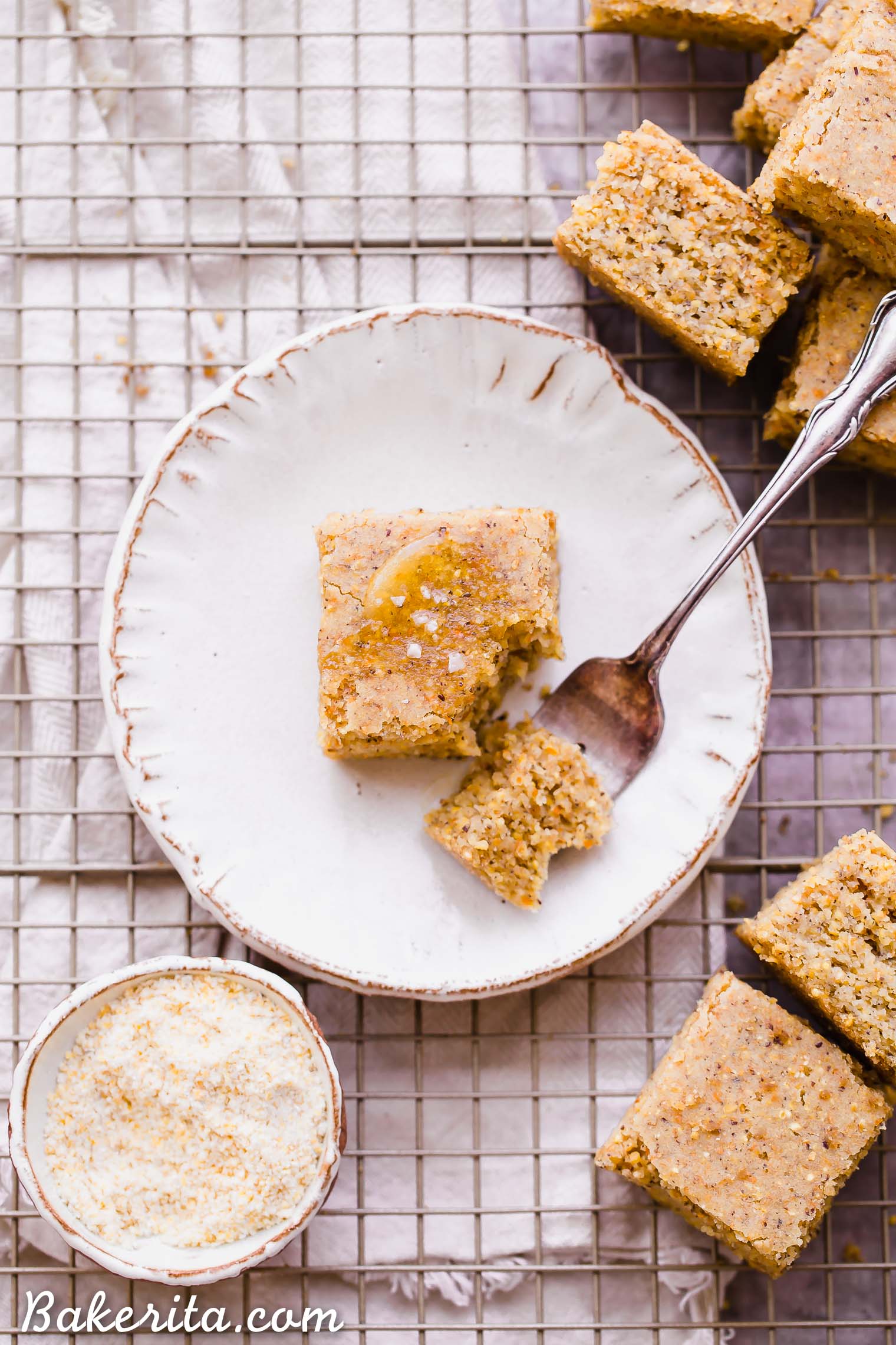 This Gluten Free + Vegan Cornbread is fluffy and light with an amazing texture from the cornmeal! It's perfect served with soup or chili, served as a side or snack, or just topped with a little bit of butter or spread.