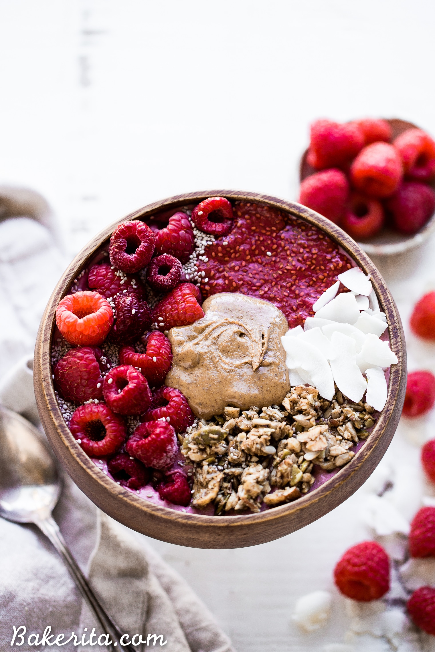 This Raspberry Almond Butter Smoothie Bowl is a creamy, sweet breakfast treat that can be made in just a few minutes and is begging to be loaded up with all of your favorite toppings! You'd never guess there was a hidden veggie in there, too.