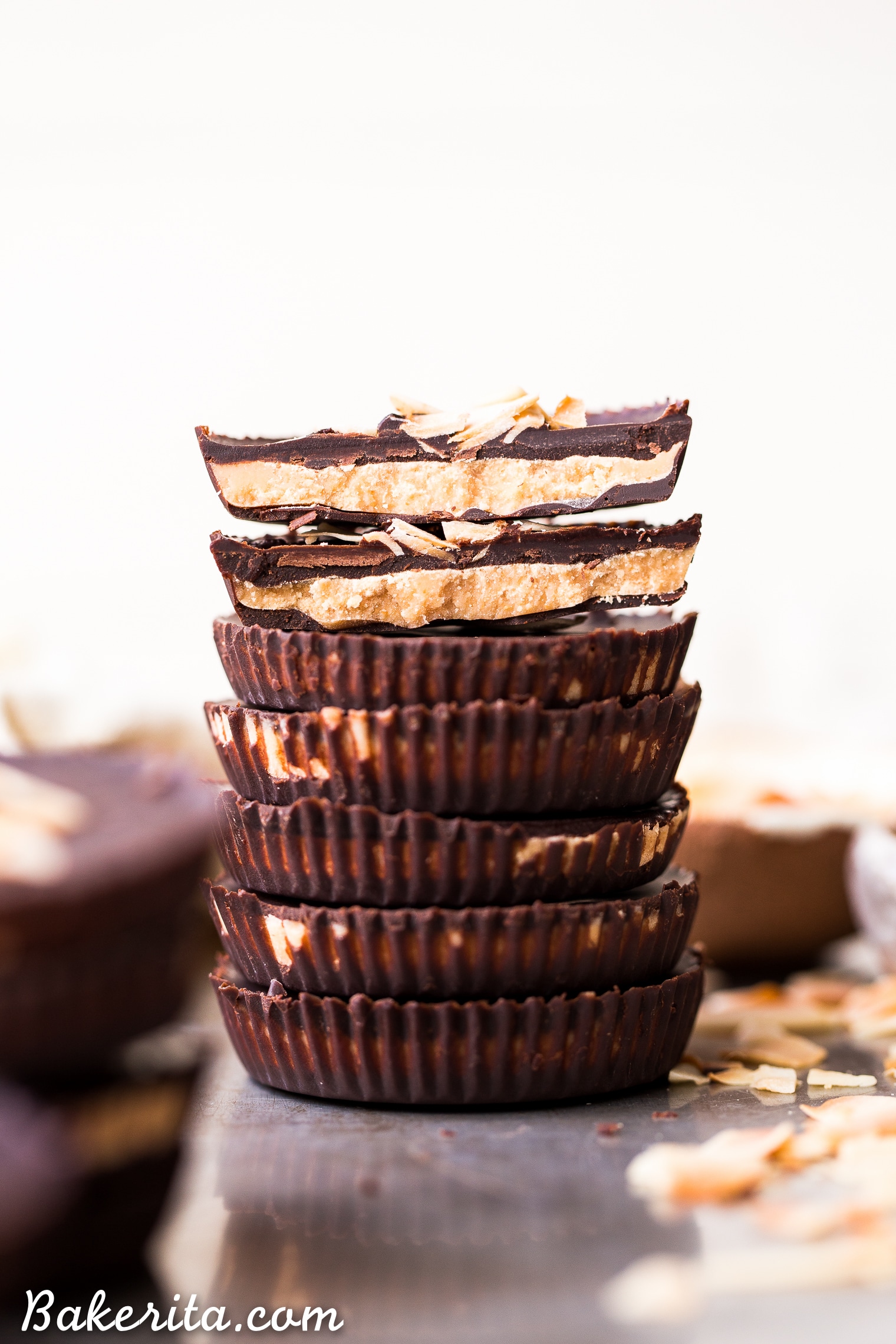These Toasted Coconut Butter Cups are made with just four simple ingredients! Toasted coconut butter is the star of the show, encased in decadent homemade chocolate for a healthy homemade candy that will satisfy your sweet tooth. You're going to love these paleo + vegan coconut butter cups.