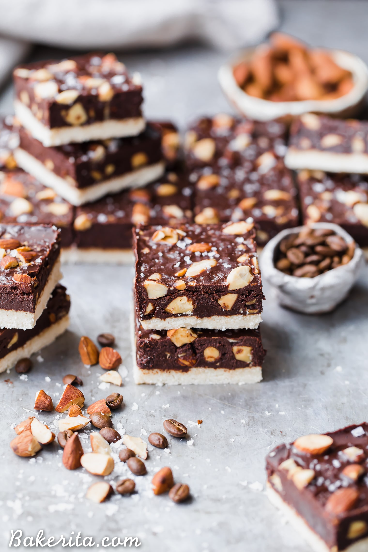 These Mocha Almond Fudge Bars are incredibly rich and delicious, with a chocolate-coffee fudge studded with crunchy almonds, all sitting on top of a simple shortbread crust. These gluten-free, paleo and vegan fudge bars are irresistible!