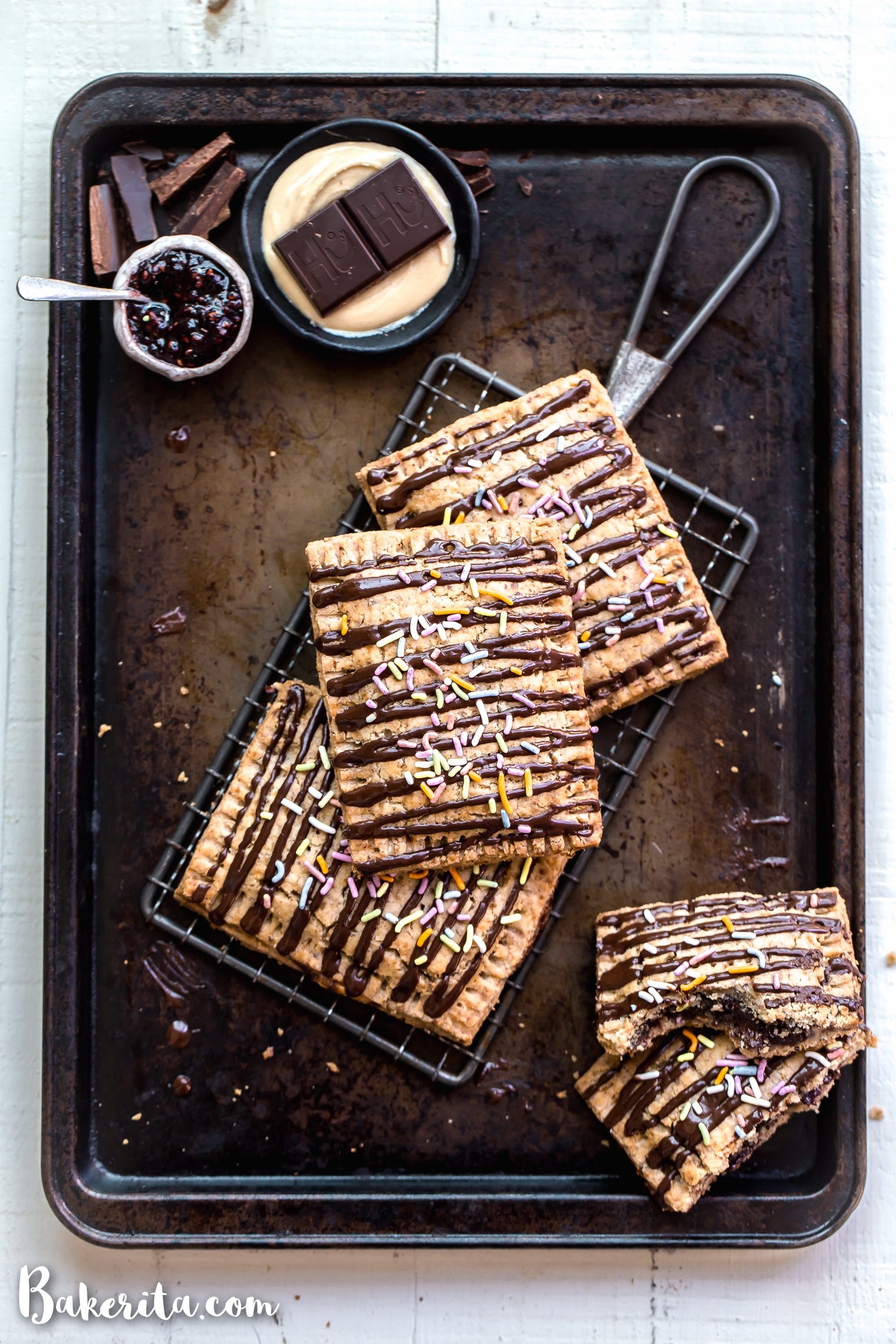 These Chocolate Cashew Butter & Jelly Pop Tarts are made with a flaky vegan and paleo crust and stuffed with cashew butter, raspberry jelly, and chopped Hu Kitchen chocolate. You’re going to go nuts for these paleo & vegan copycat of your favorite childhood treat!