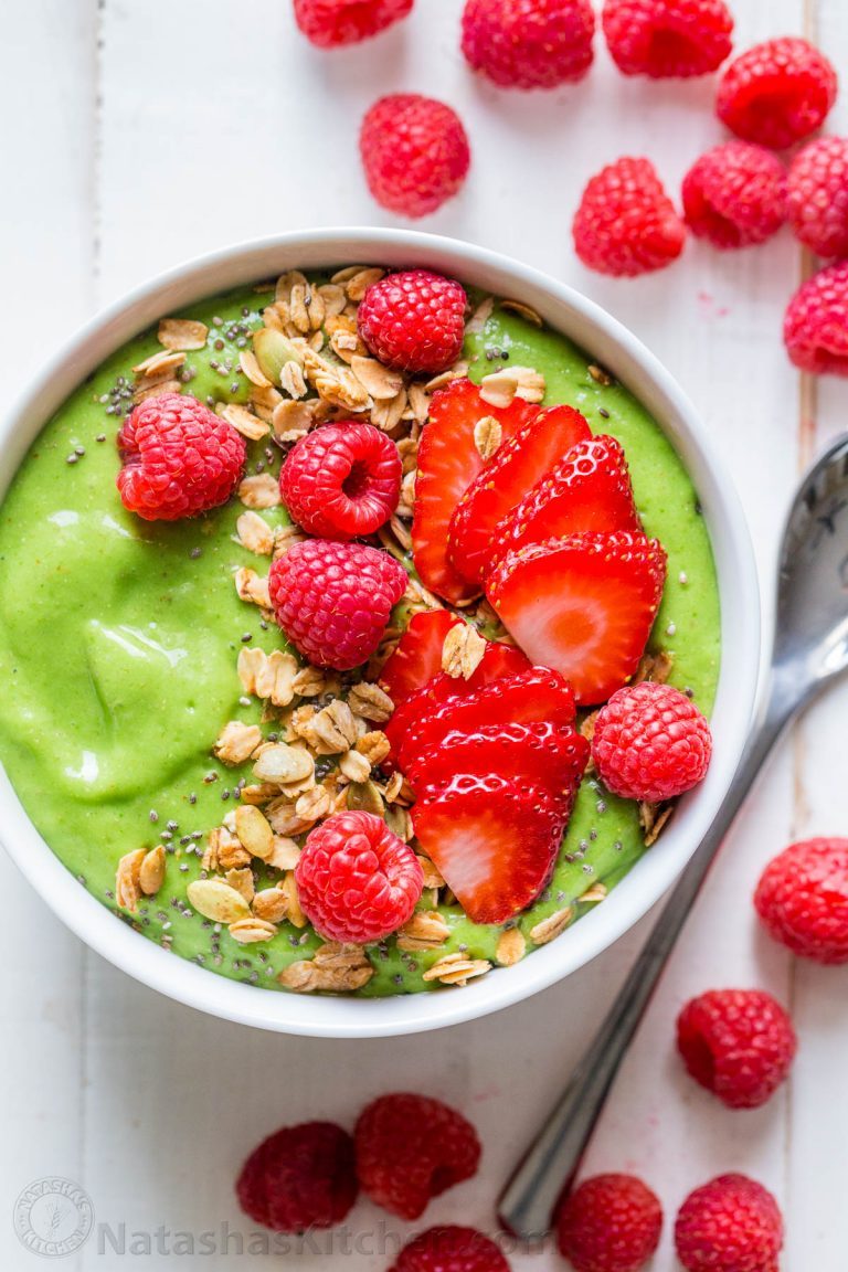 A healthy Green Smoothie Bowl packed with mango, pineapple, avocado and spinach. These smoothie bowls are naturally sweet, energizing, rich in antioxidants and fiber. Learn the secrets to blending a thick and irresistible smoothie bowl. | natashaskitchen.com