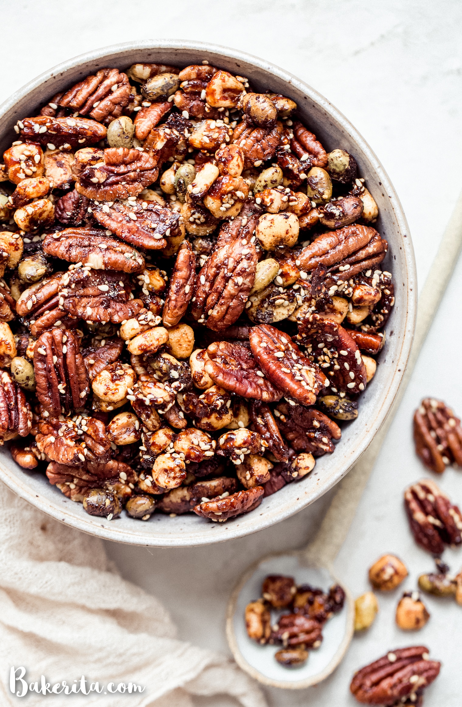 This Sesame Tamari Pecan Snack Mix is a deliciously crunchy snack that's bursting with sweet, savory, and umami flavors. It's gluten-free and vegan!