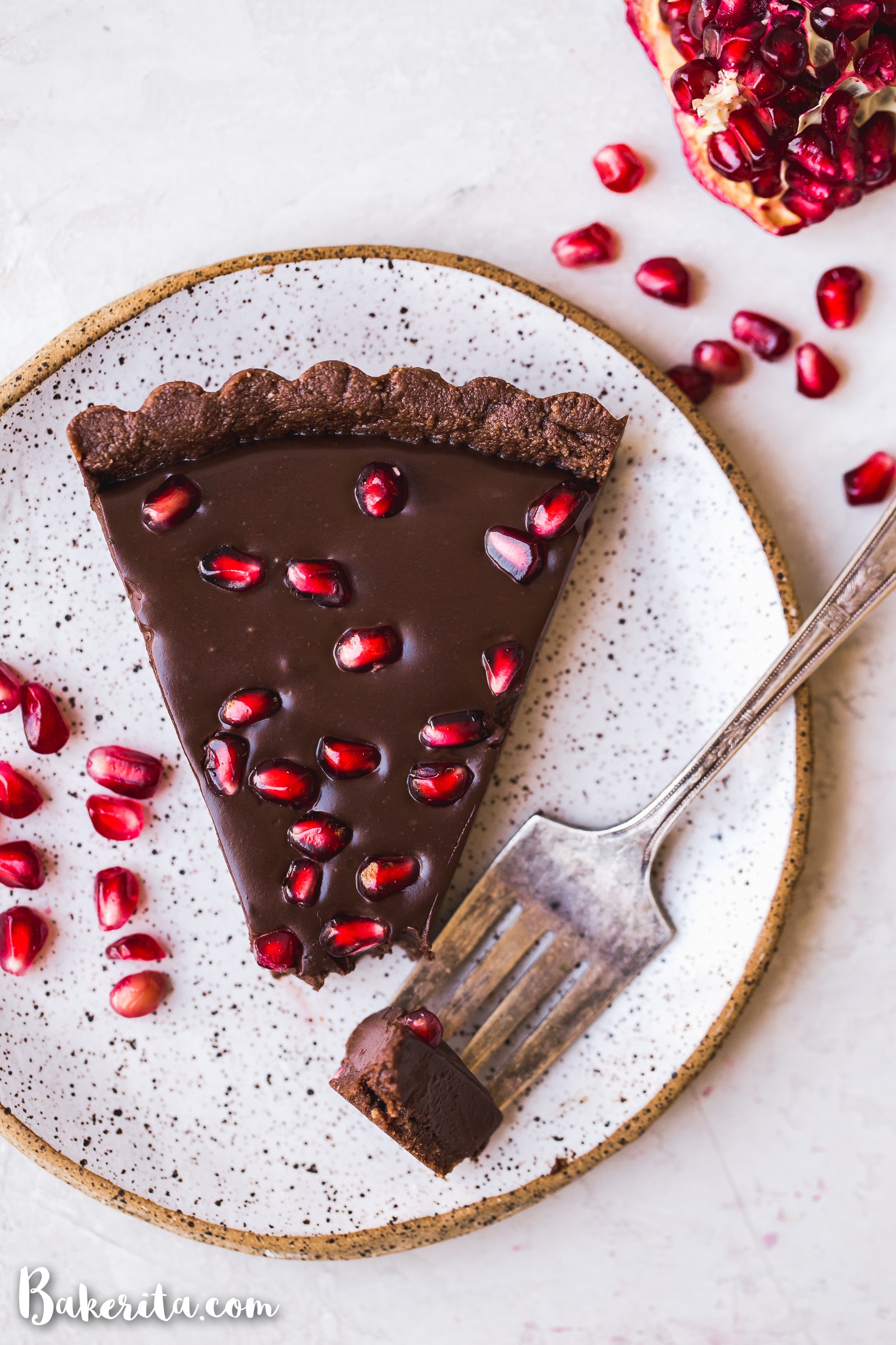 This No-Bake Chocolate Pomegranate Tart is made with 8 simple ingredients and is perfect for holiday entertaining! No baking required for this gluten-free, paleo, and vegan tart.