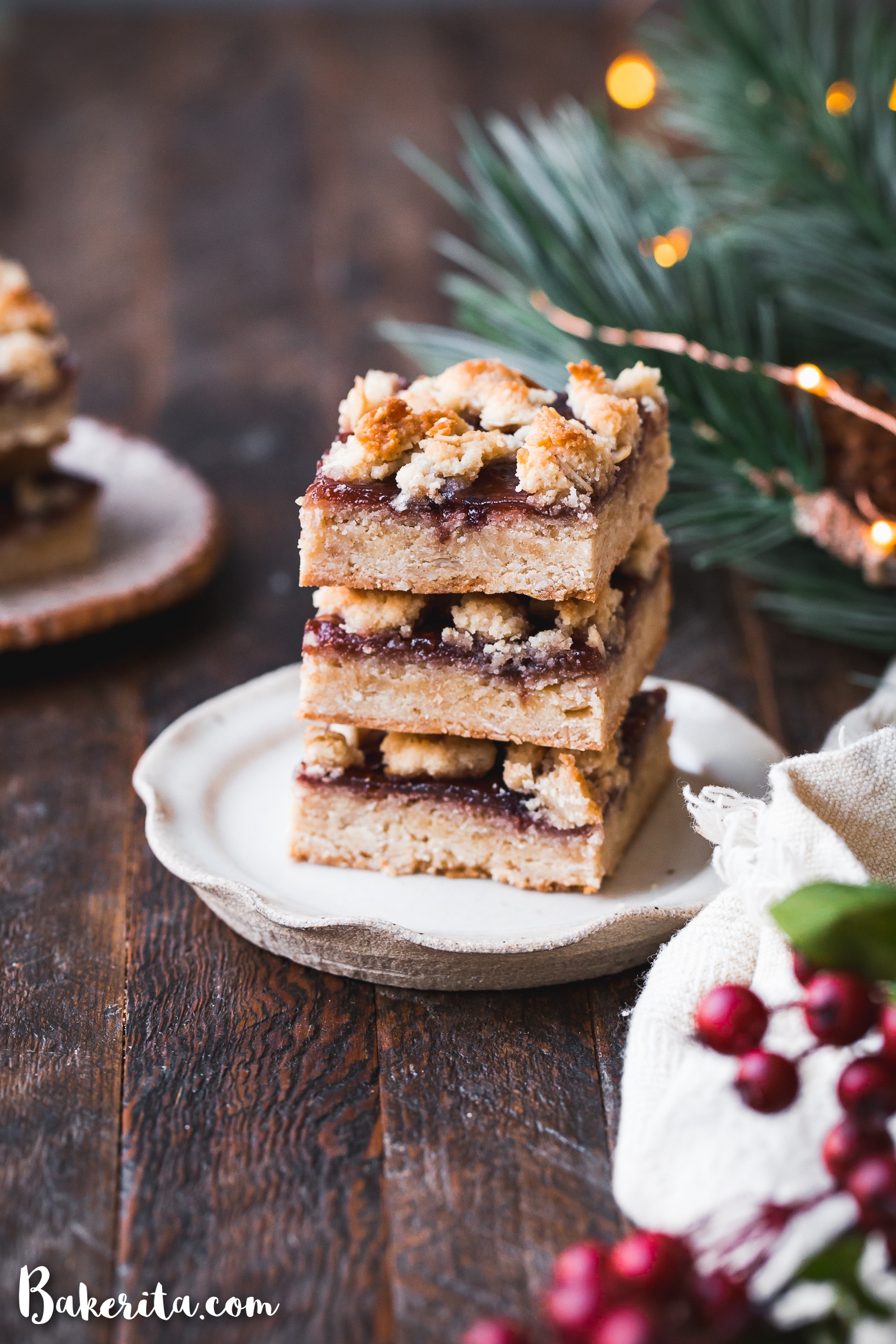 These Gluten-Free Vegan Jam Bars are made with a scrumptious oatmeal crumble crust that doubles as a crumb topping and a thick layer of jam in the middle. They're the perfect easy, vegan holiday dessert.