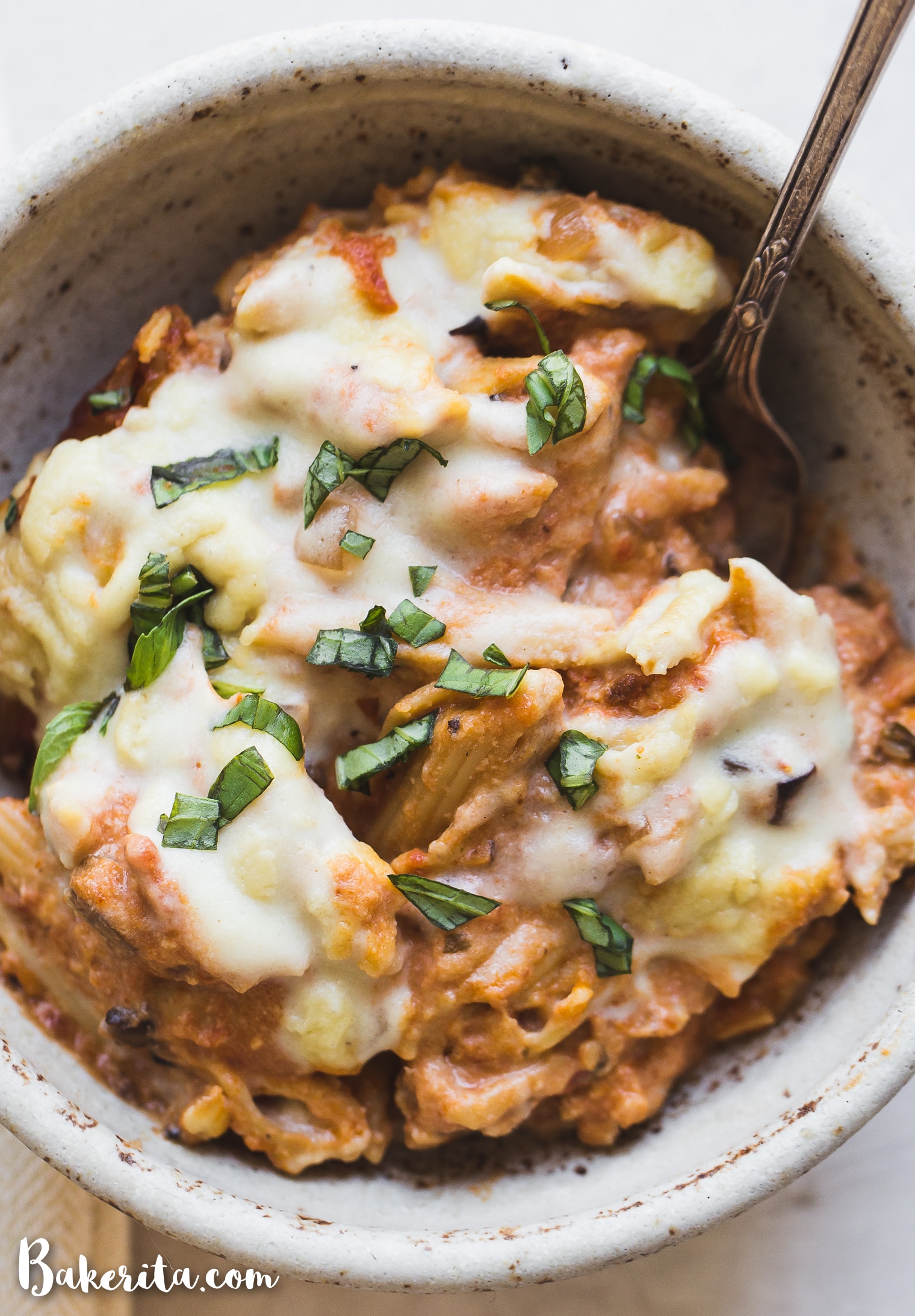 How to make Vegan Baked Ziti that's creamy, cheesy, and absolutely delicious! It's made with gluten-free noodles, marinara sauce, easy vegan ricotta cheese, and homemade vegan mozzarella sauce.