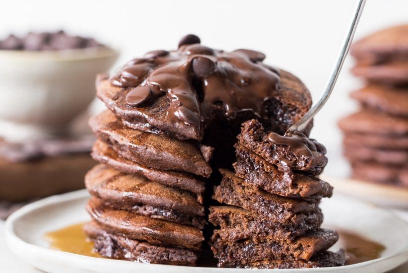 These Gluten-Free Vegan Double Chocolate Pancakes are a deliciously fluffy and decadent breakfast! Made with rolled oats and loaded with chocolate chips.